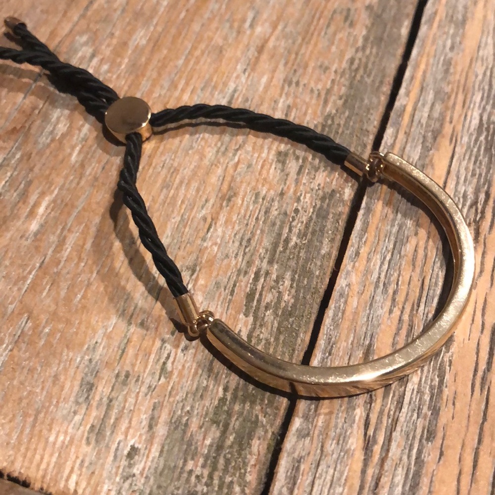 Black and gold adjustable bracelet.